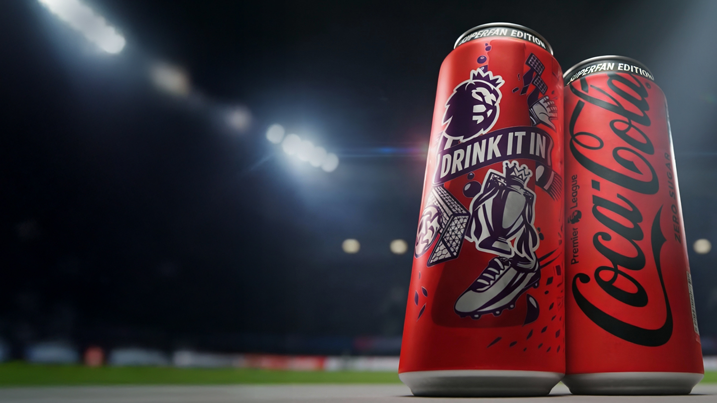 Football players in front of a Can of Coca Cola